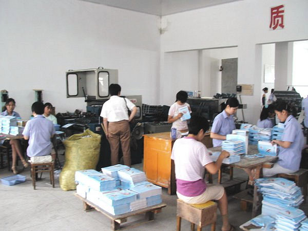 Workers Assembling Books