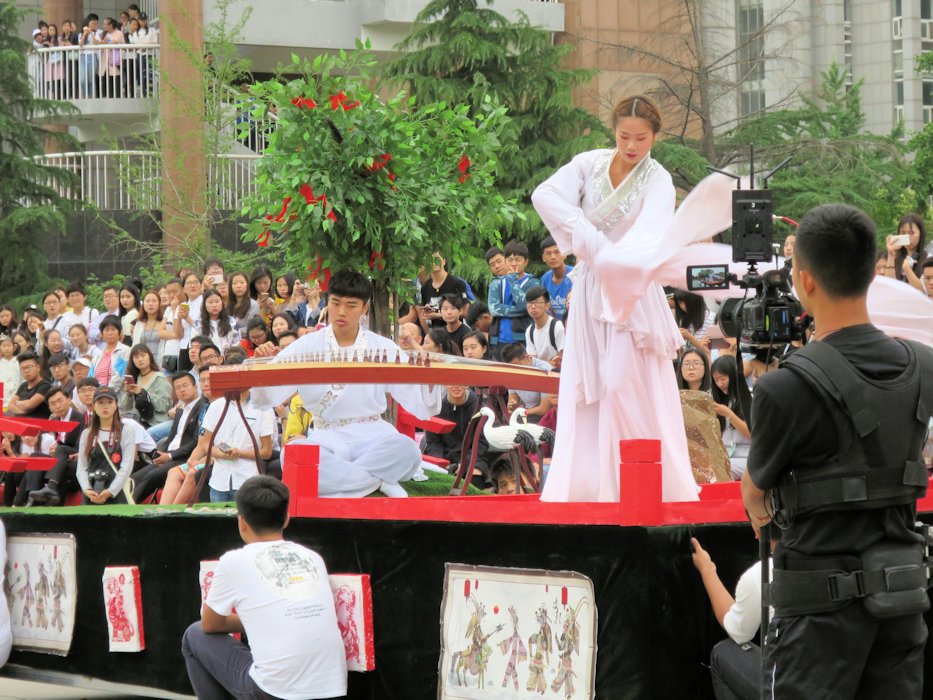 Man Playing Zheng with Dancing Lady  