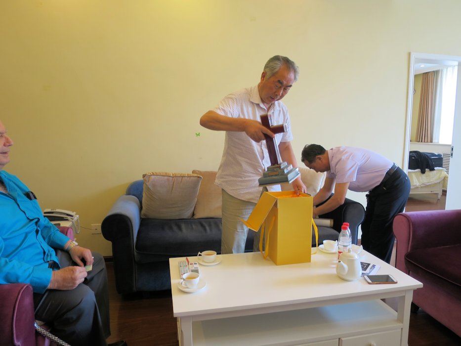 Pastor Unpacks Gift Cross  