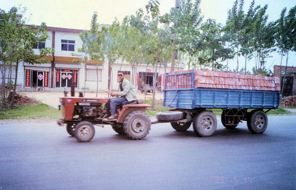Tractor Pulling Trailer of Bricks