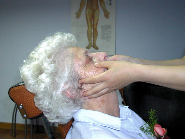 Staff Massages Bernice's Eyes