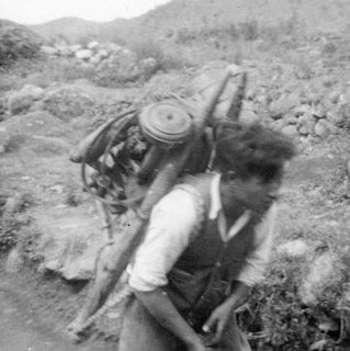 Korean Laborers carrying a Power Generator