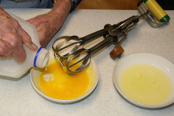 Step 11 -  Add Milk to Yolks 